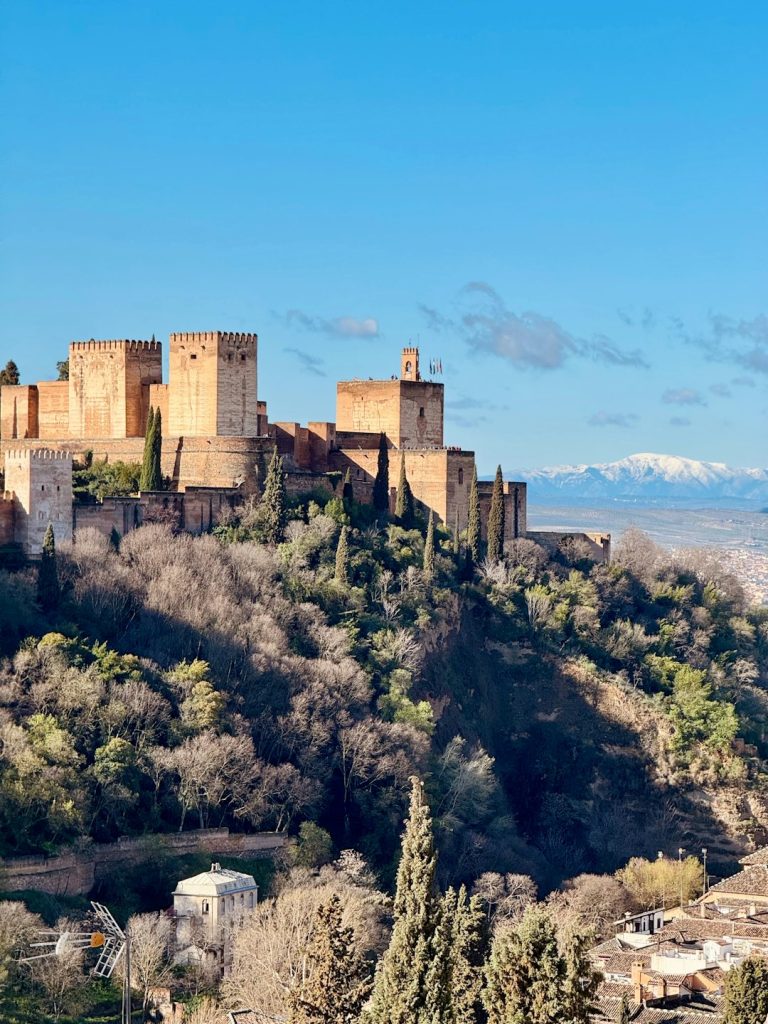 the-alhambra-palace-rises-above-a-scenic-landscape-2jnotcf5v3u